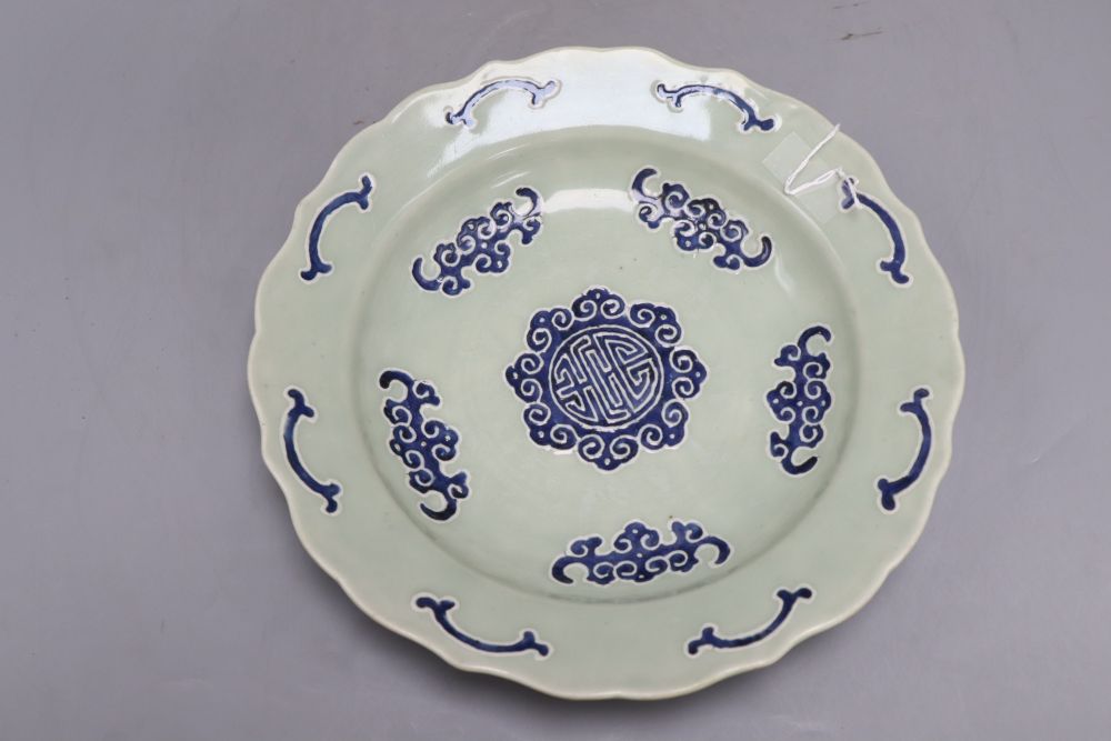 A Chinese celadon glazed bat and shou medallion dish, Qianlong mark but 19th century